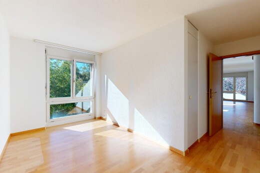 empty room with light wood finished floors and baseboards