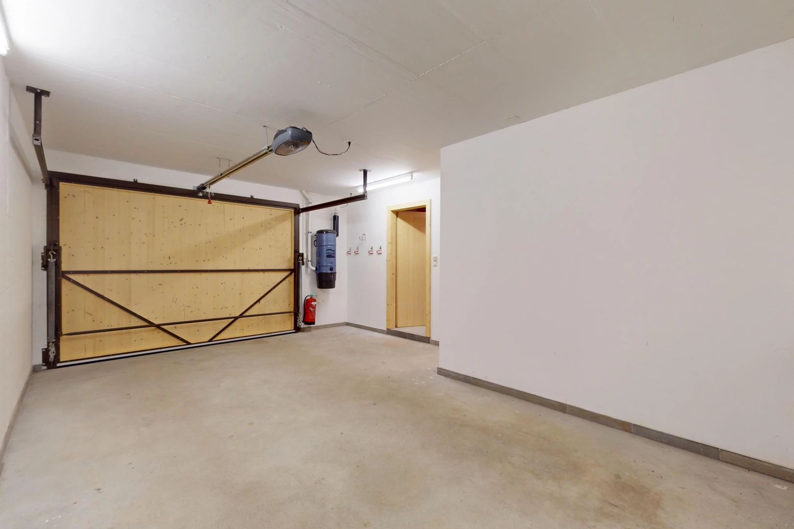 view of car parking featuring water heater