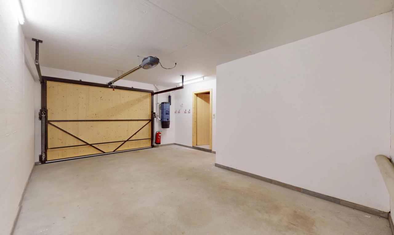 view of car parking featuring water heater