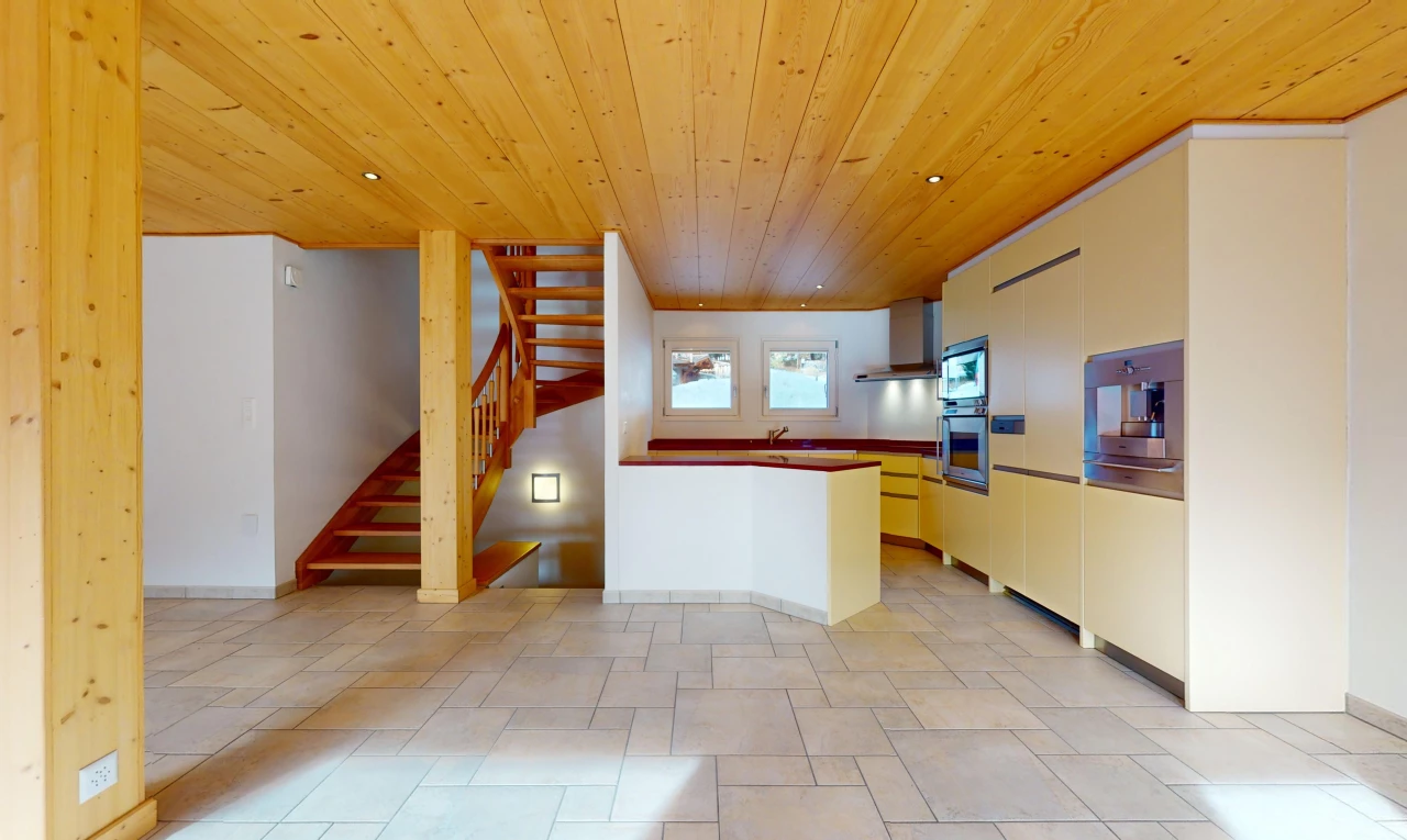 kitchen with wall chimney exhaust hood, appliances with stainless steel finishes, light tile floors, and wooden ceiling