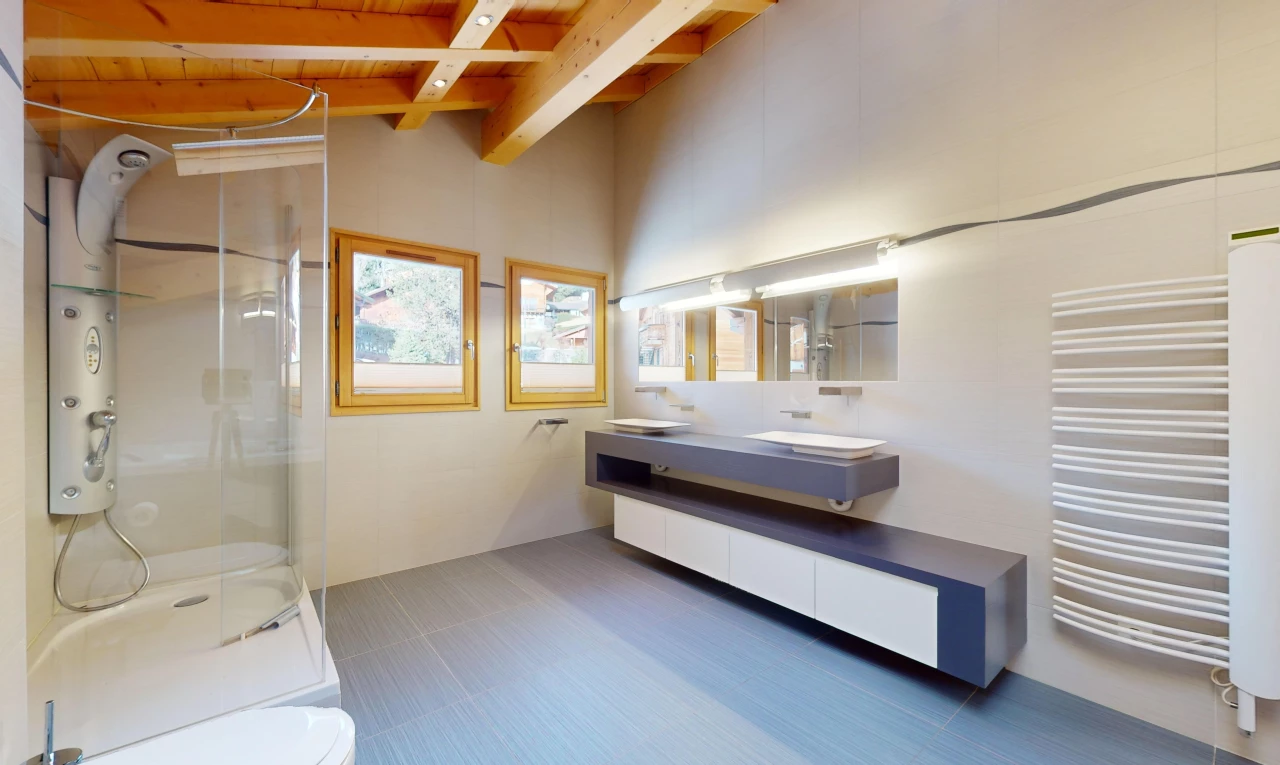 bathroom with toilet, a shower with door, large vanity, beam ceiling, and tile floors