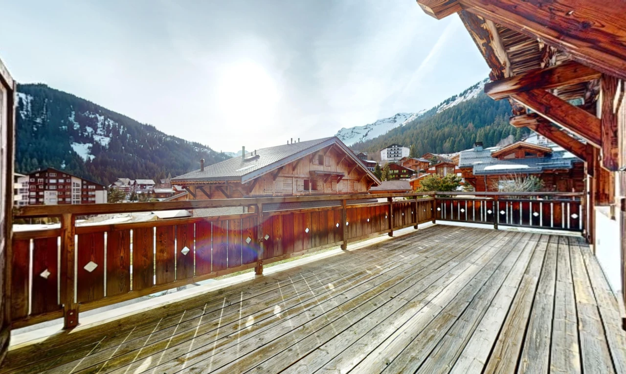 exterior space with a mountain view and a balcony