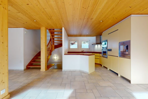 kitchen with wall chimney exhaust hood, appliances with stainless steel finishes, light tile floors, and wooden ceiling