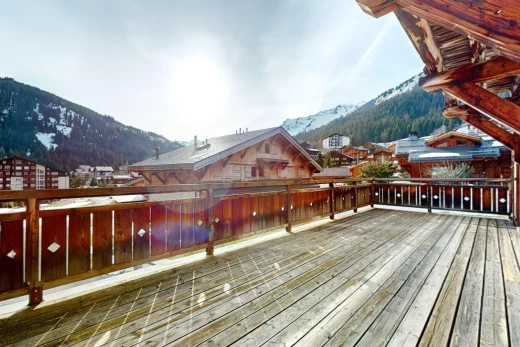 exterior space with a mountain view and a balcony