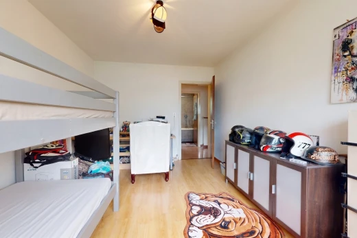 chambre avec cloison sèche, drywall, sol en finition bois, wood finish floor, et inside property