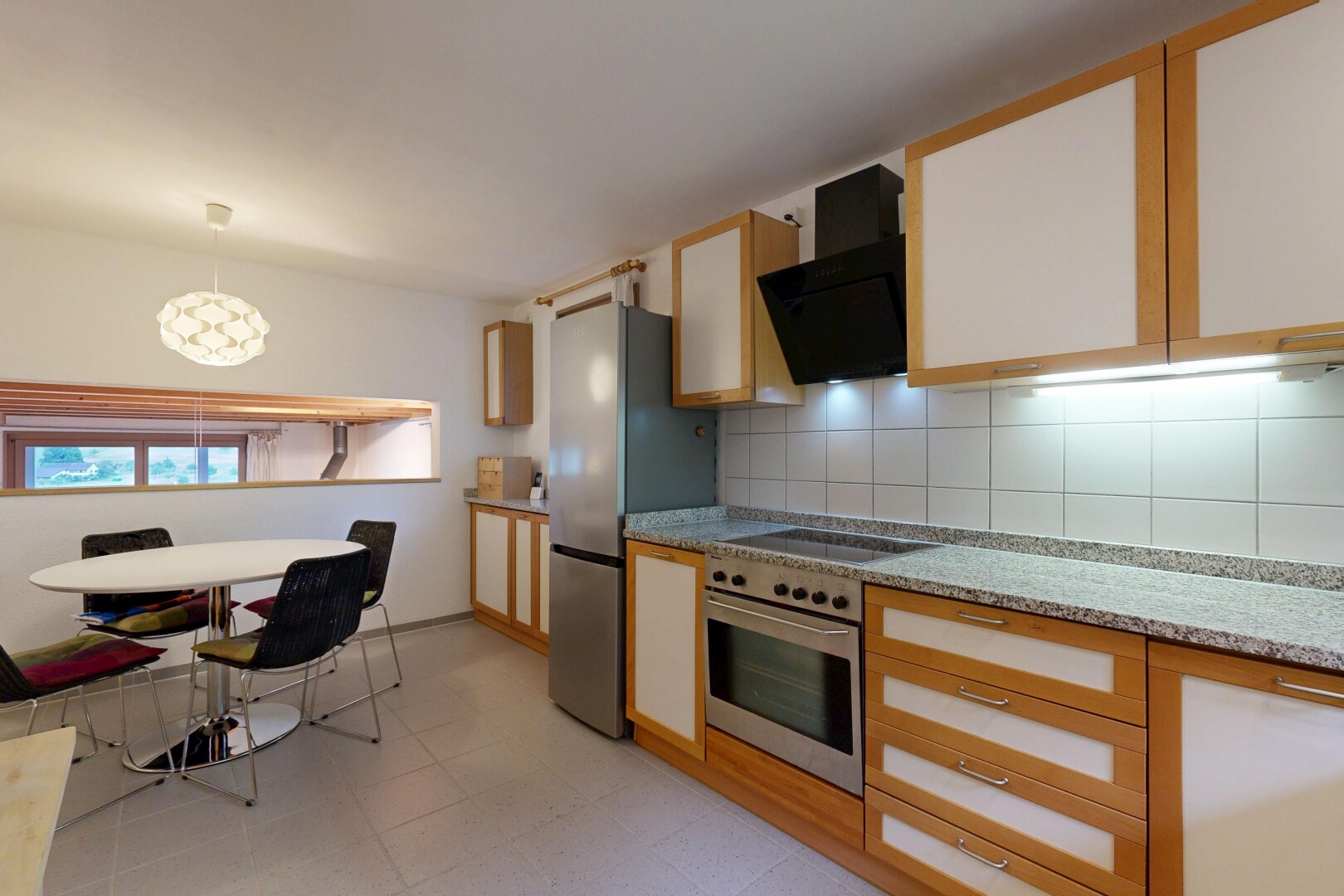 küche mit ofen, light countertops, light floor, two tone kitchen, und natürliches licht