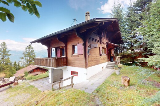 außenansicht mit property visible, horizontale verkleidung, holzverkleidung, schornstein, und day time