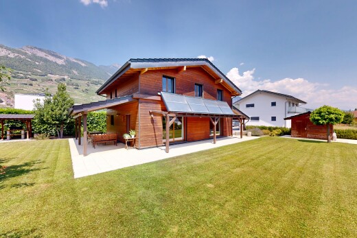 view of home featuring a yard and a patio area