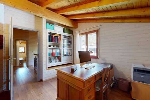 home office with hardwood / wood-style floors, wood ceiling, and wood walls
