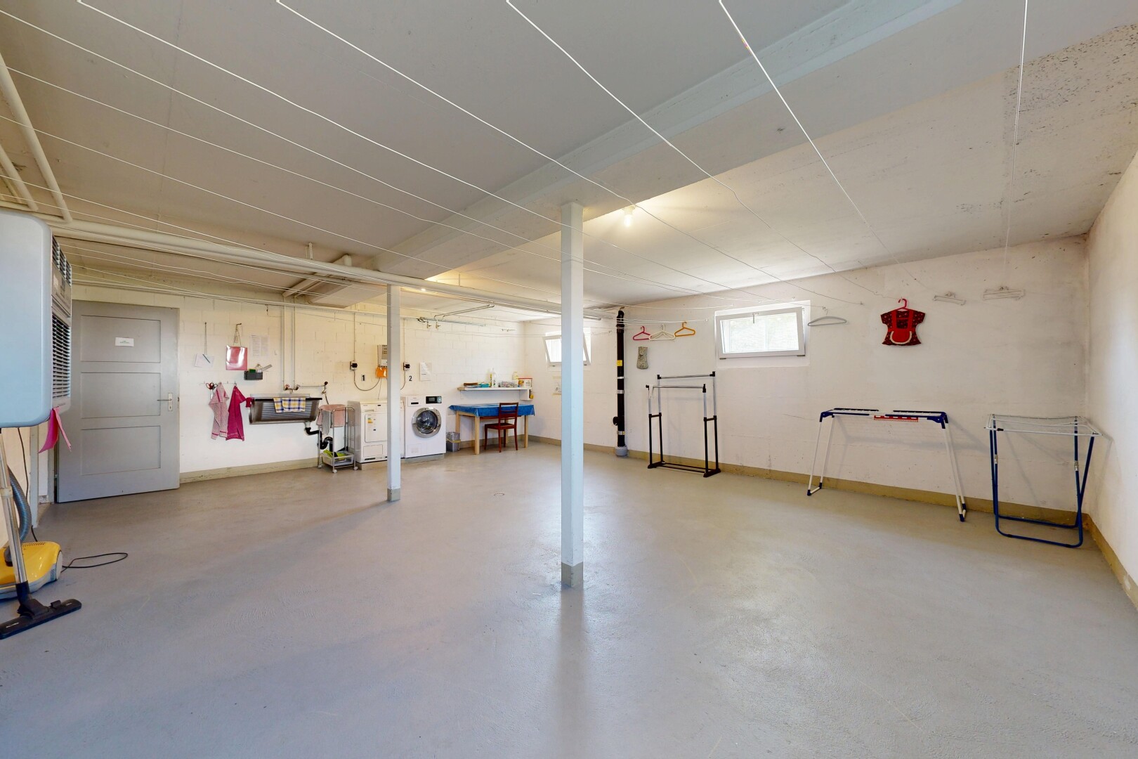 gym with concrete flooring and washer / clothes dryer