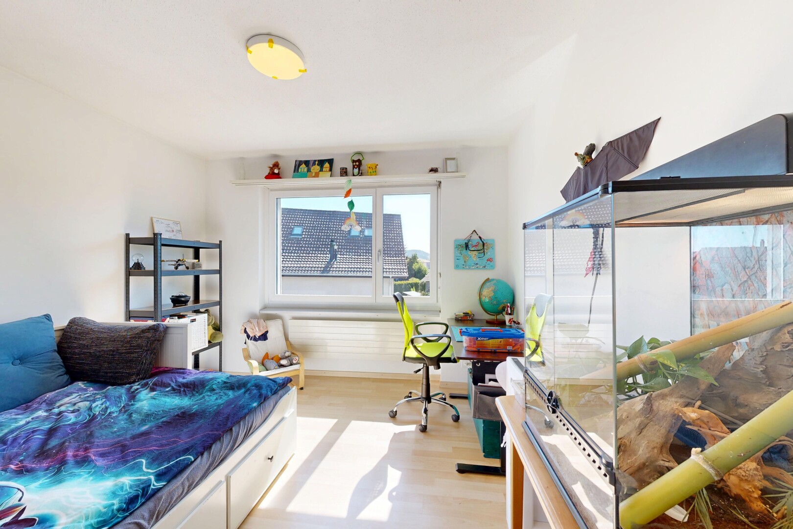 room / bedroom with light wood-style floors and a desk