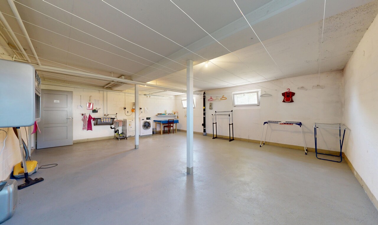 gym with concrete flooring and washer / clothes dryer