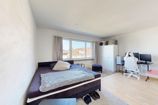 room / bedroom featuring an office area and light wood-style floors