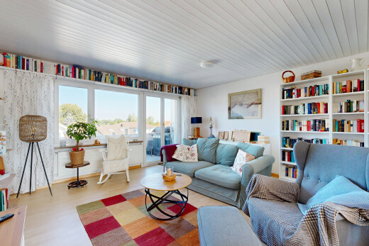 living room with light wood-style floors and wooden ceiling