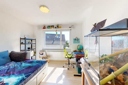 room / bedroom with light wood-style floors and a desk