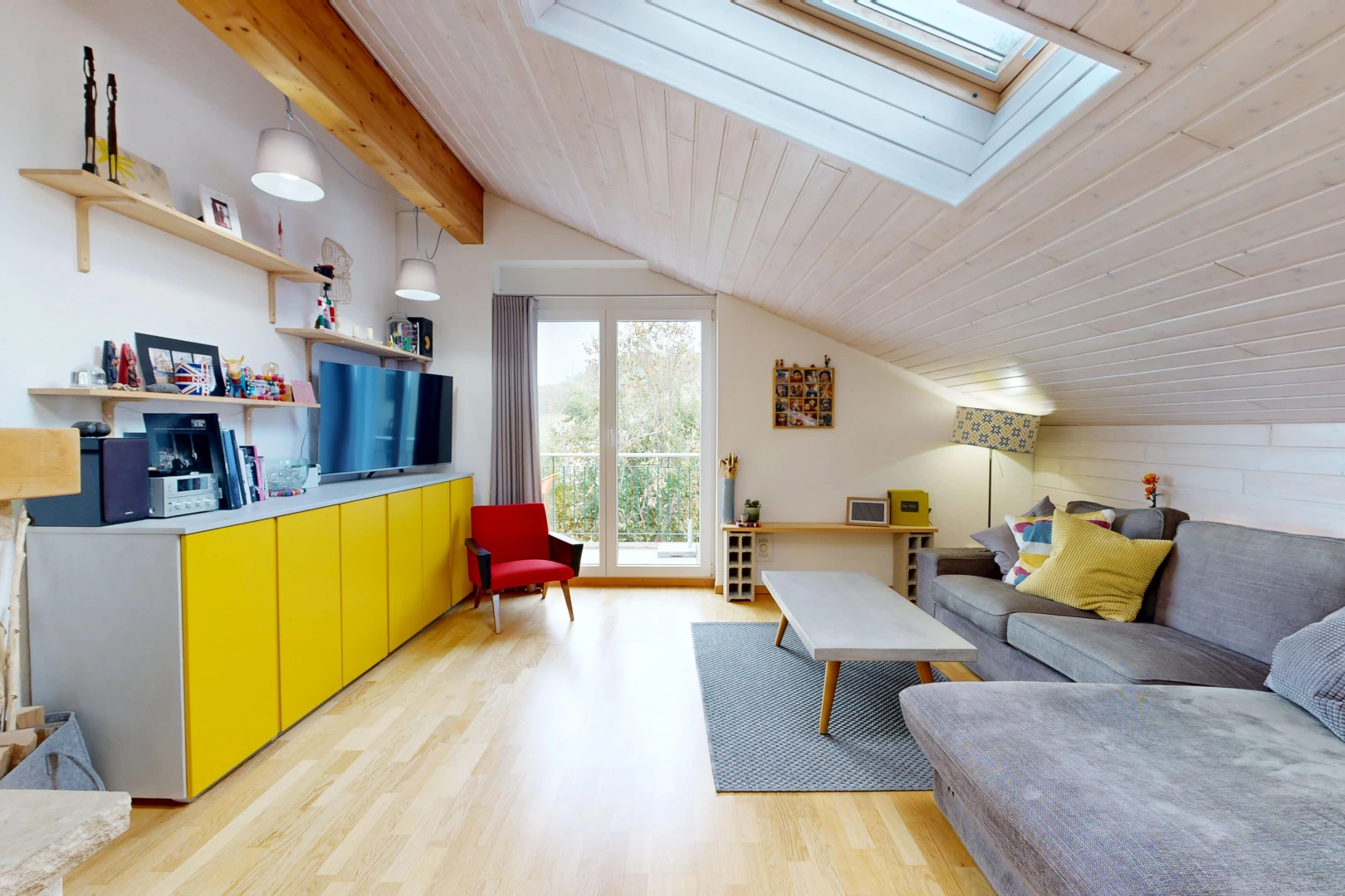 living room featuring lofted ceiling with skylight, access to outside, pendant lighting, wood ceiling, and light wood-style flooring