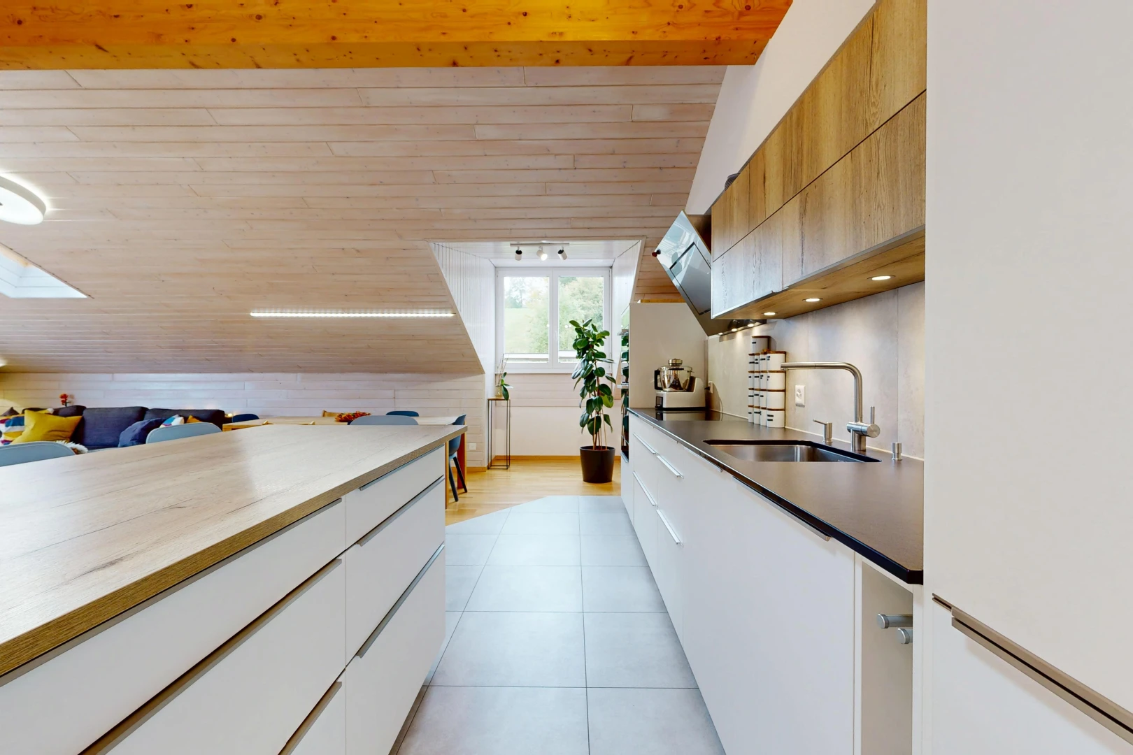 two tone kitchen with modern cabinets, white fridge, two tone color scheme, a vaulted wood ceiling, and light tile patterned floors