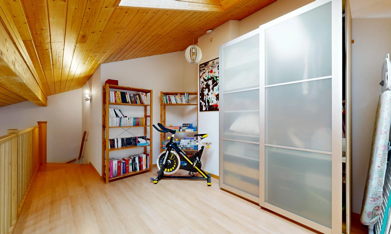 room featuring a vaulted wooden ceiling and light wood-style floors