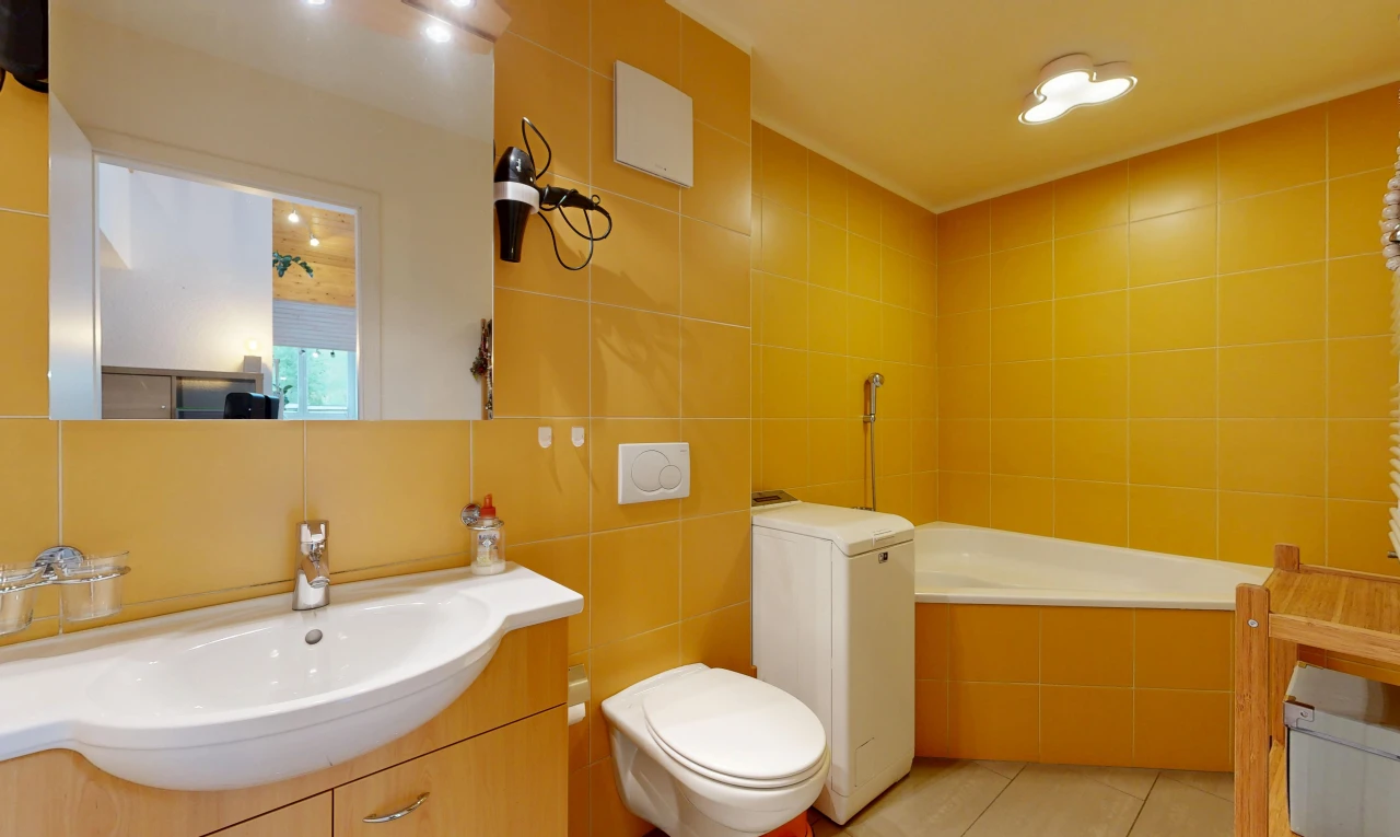 full bath with vanity, tile walls, a bath, and light tile patterned flooring