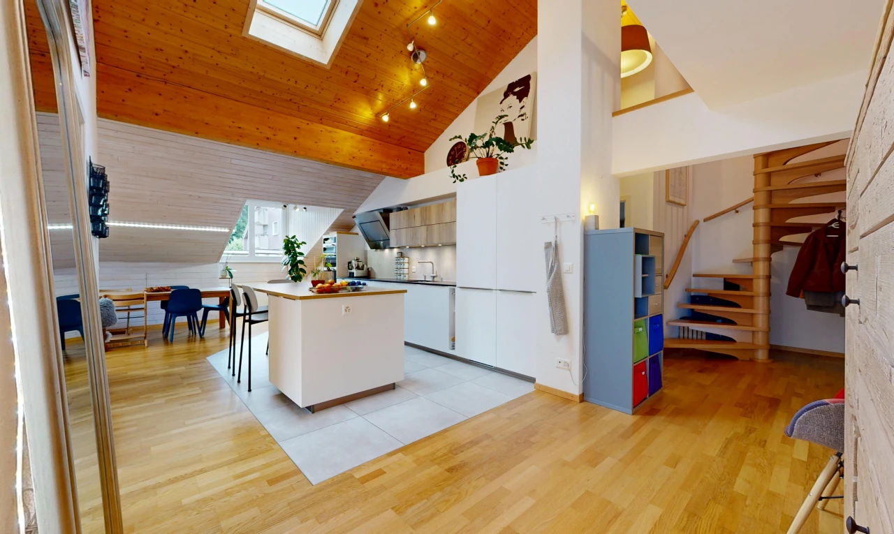 kitchen with vaulted ceiling with skylight, a kitchen island, light wood-style floors, rail lighting, and wooden ceiling