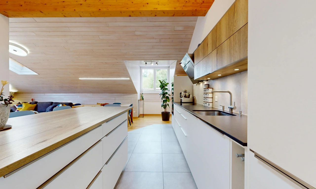 two tone kitchen with modern cabinets, white fridge, two tone color scheme, a vaulted wood ceiling, and light tile patterned floors