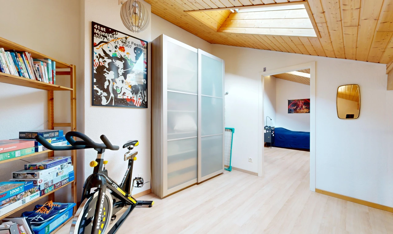 hall with a vaulted wooden ceiling and baseboards
