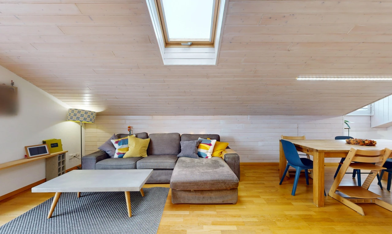living area with lofted ceiling with skylight, wooden ceiling, wood walls, and light wood-style flooring