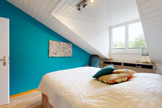 room featuring a vaulted wood ceiling, light wood-style flooring, and track lighting