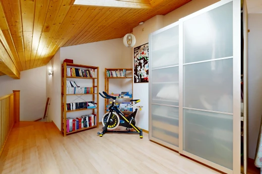 room featuring a vaulted wooden ceiling and light wood-style floors