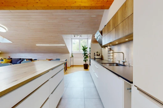 two tone kitchen with modern cabinets, white fridge, two tone color scheme, a vaulted wood ceiling, and light tile patterned floors