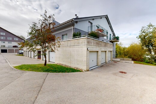 view of home featuring community garages