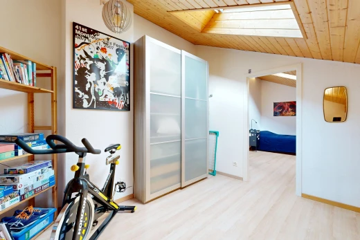 hall with a vaulted wooden ceiling and baseboards