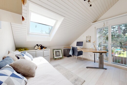 office space with a vaulted wood ceiling, light wood-style floors, and a skylight