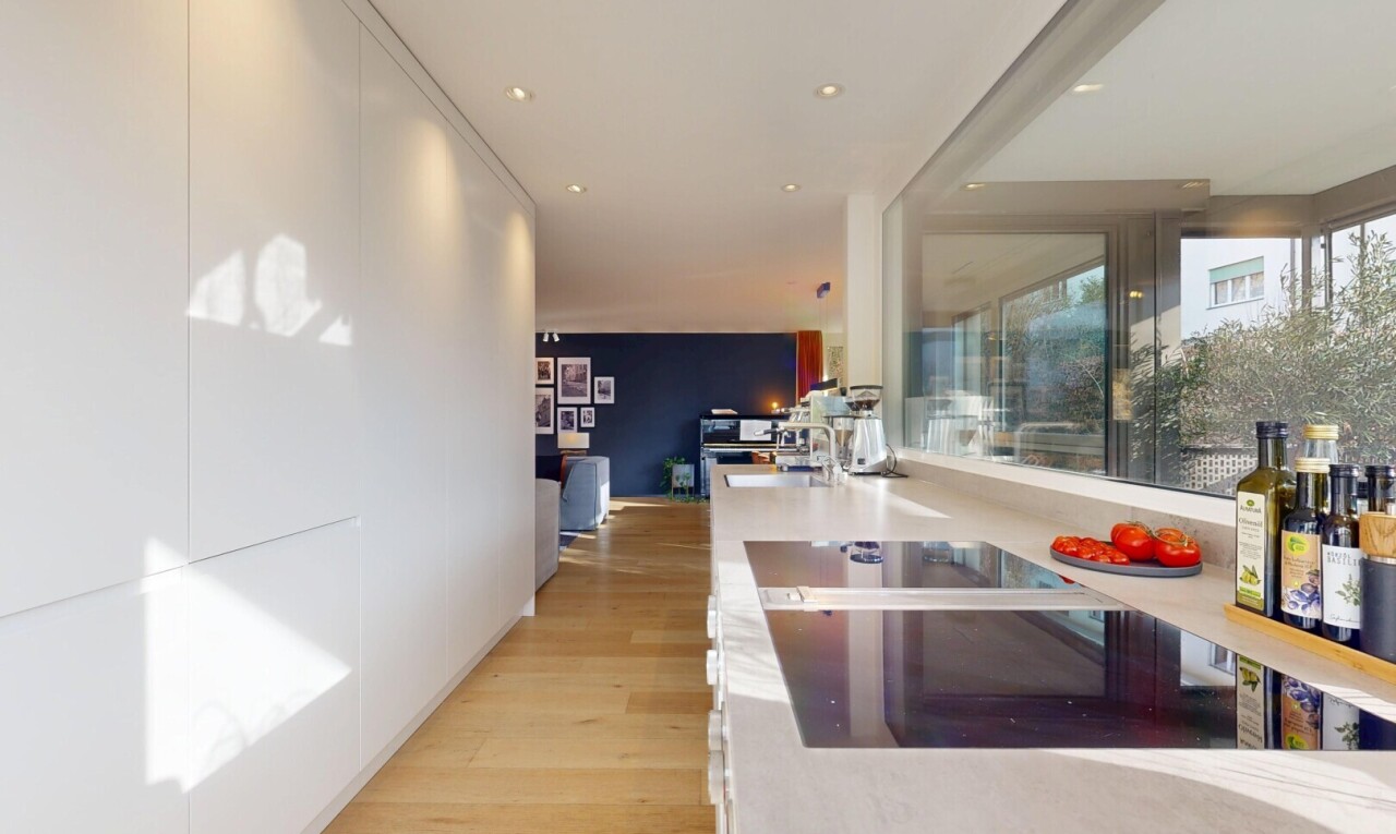 kitchen featuring light wood-style flooring, recessed lighting, white cabinetry, and black electric stovetop