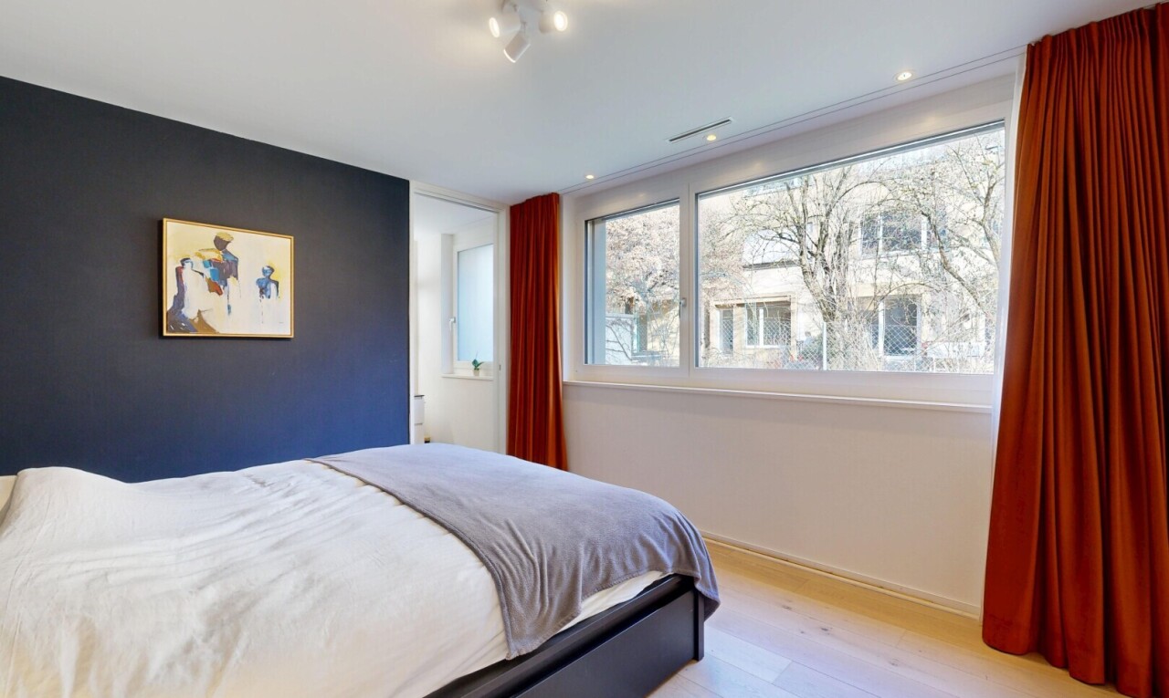 room featuring hardwood / wood-style flooring and an accent wall