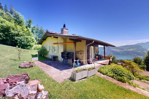 außenansicht mit blick auf die berge, mountain view, terrasse, property visible, und schornstein