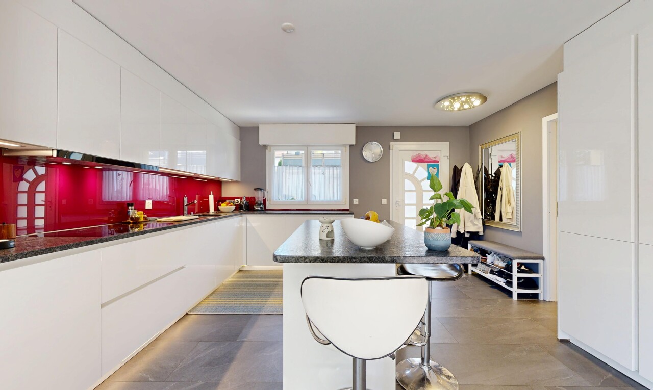 kitchen featuring white cabinetry, modern cabinets, and a kitchen island