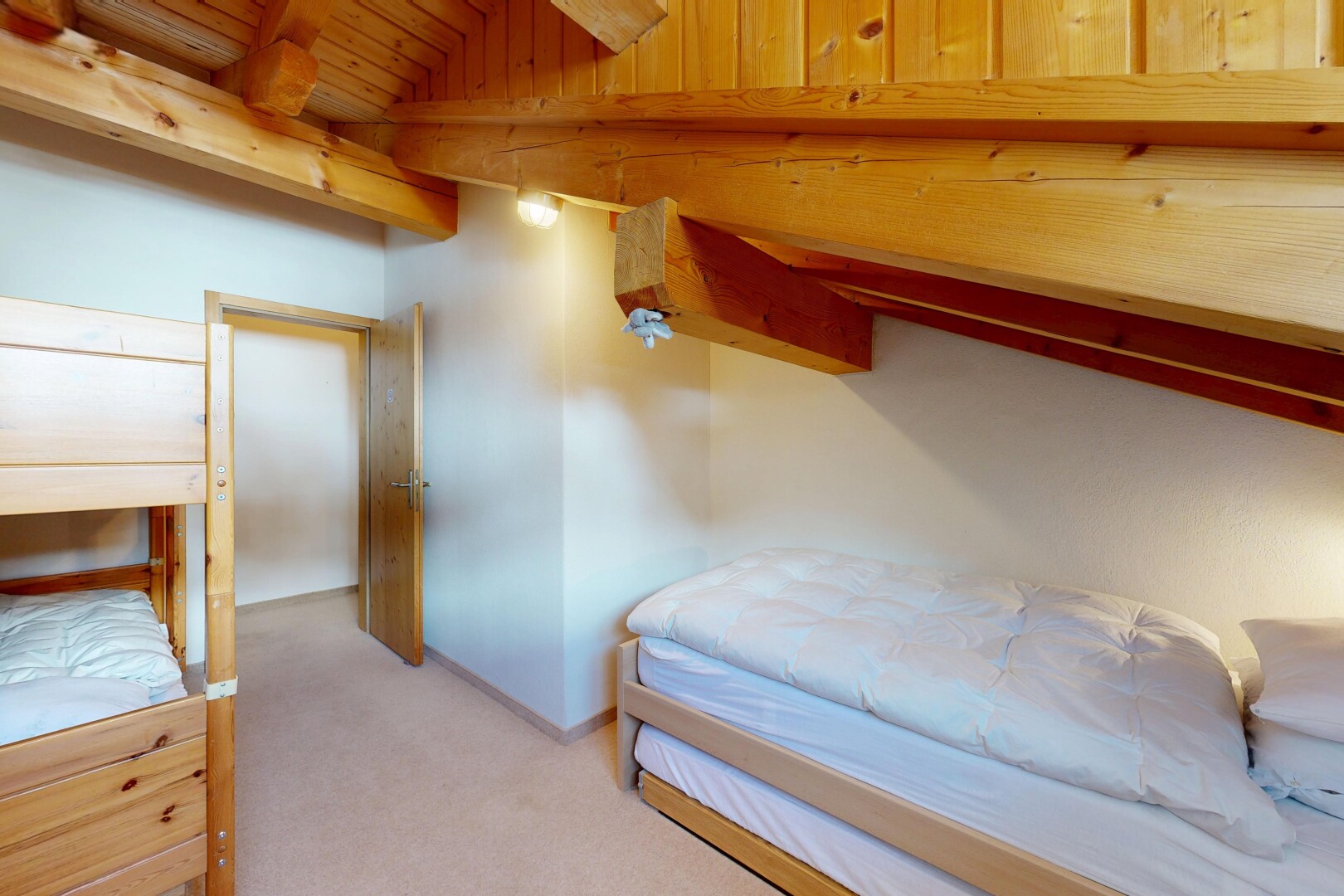 room with light carpet, lofted ceiling with beams, and wooden ceiling
