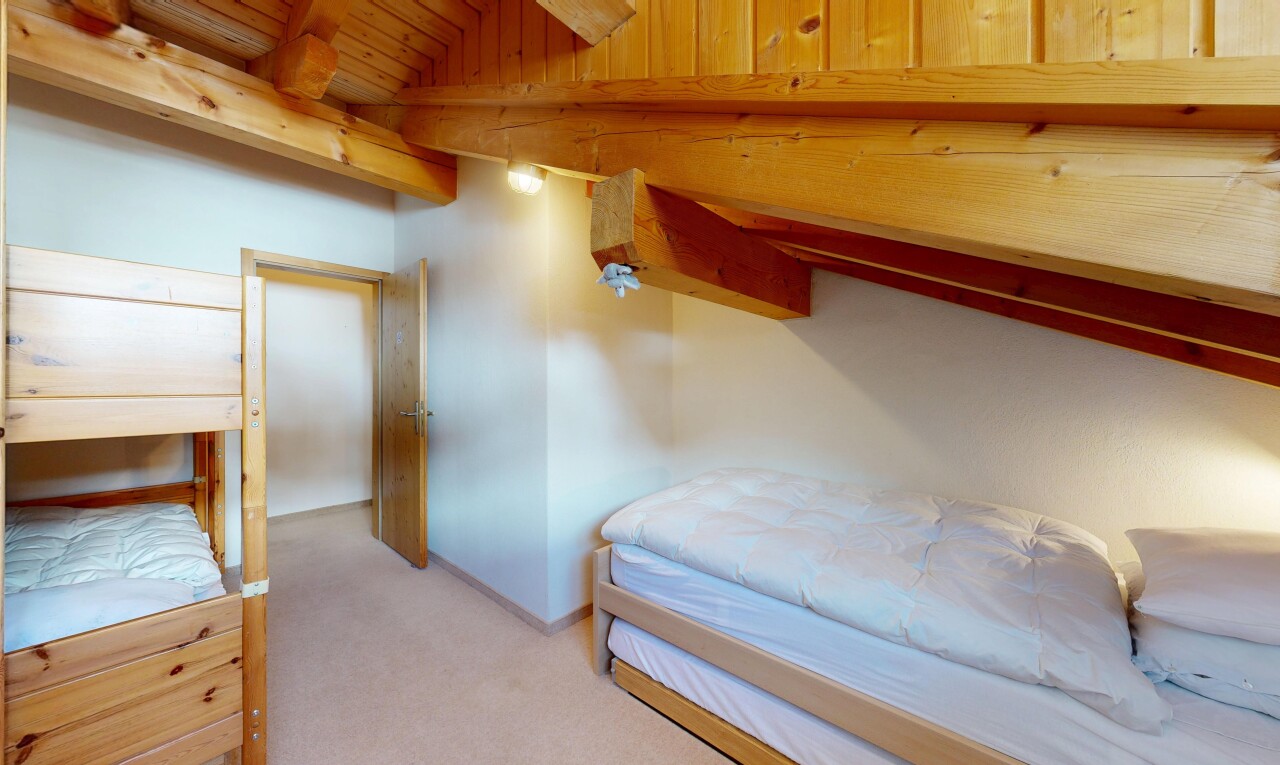 room with light carpet, lofted ceiling with beams, and wooden ceiling