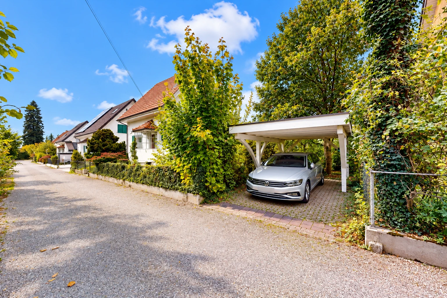 outdoor house featuring a carport