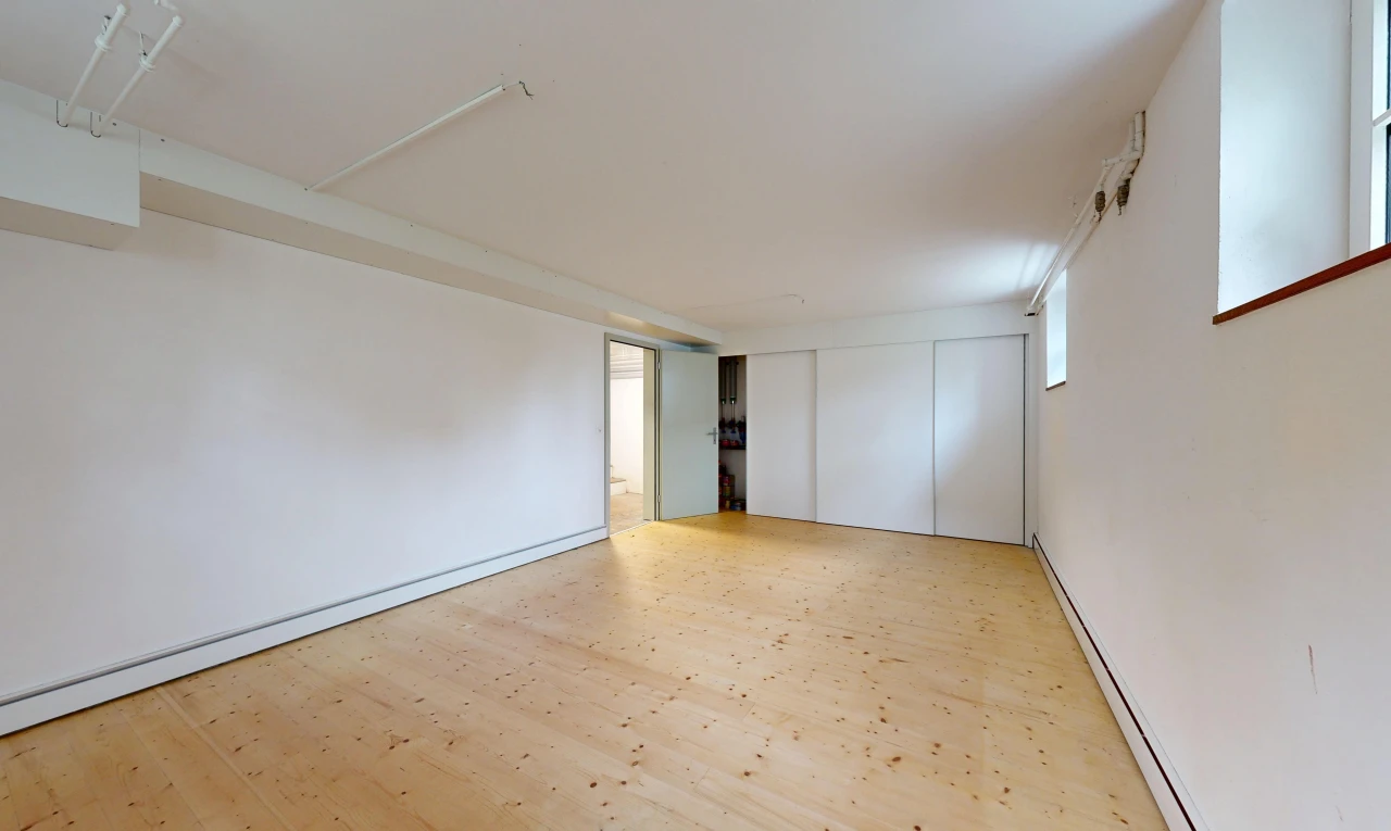 spare room featuring baseboard heating and light wood-style flooring