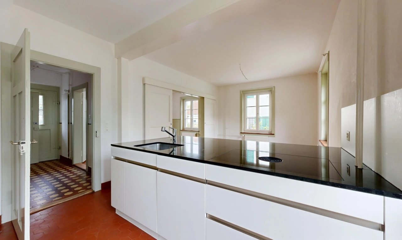 kitchen featuring white cabinets, a peninsula, and modern cabinets
