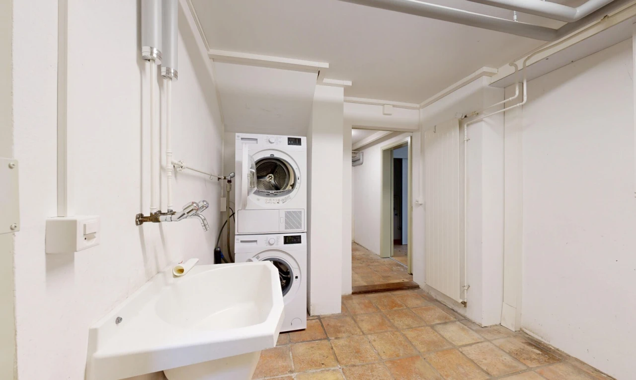 laundry area with stacked washer / dryer