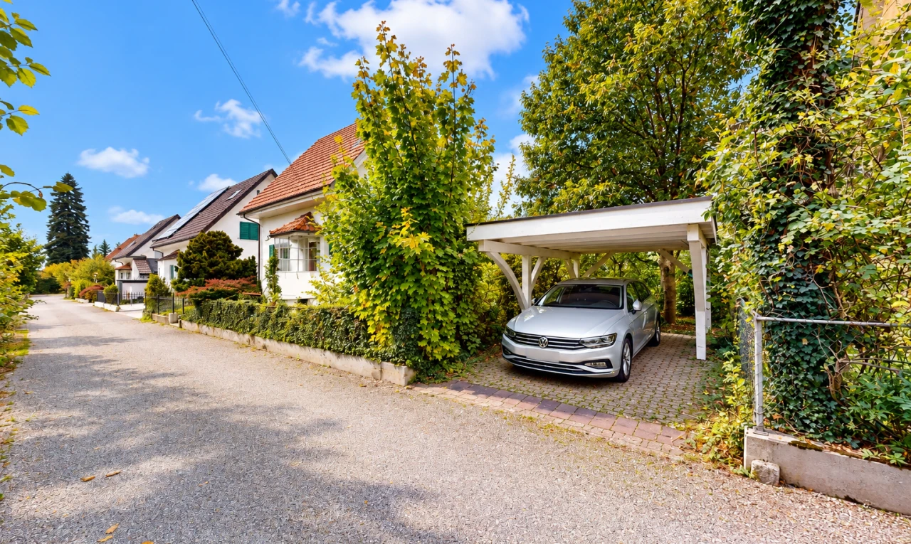 outdoor house featuring a carport