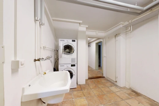 laundry area with stacked washer / dryer