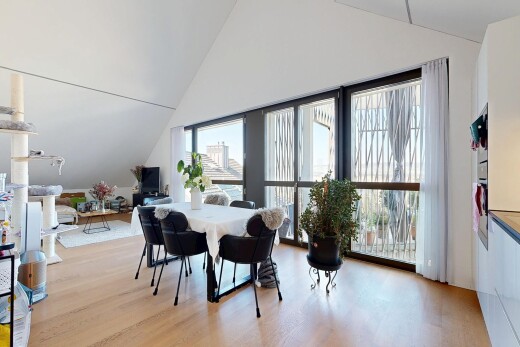 dining room with vaulted ceiling and light wood finished floors