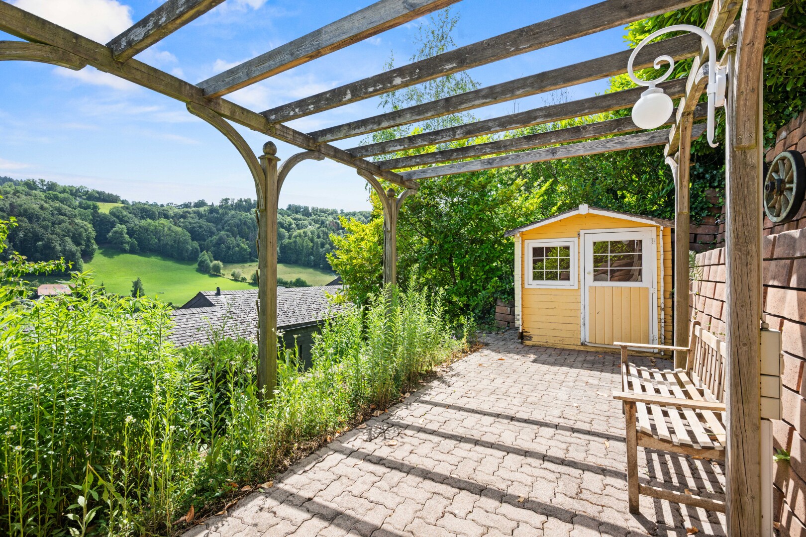 patio / terrace featuring a storage unit, a pergola, and a patio