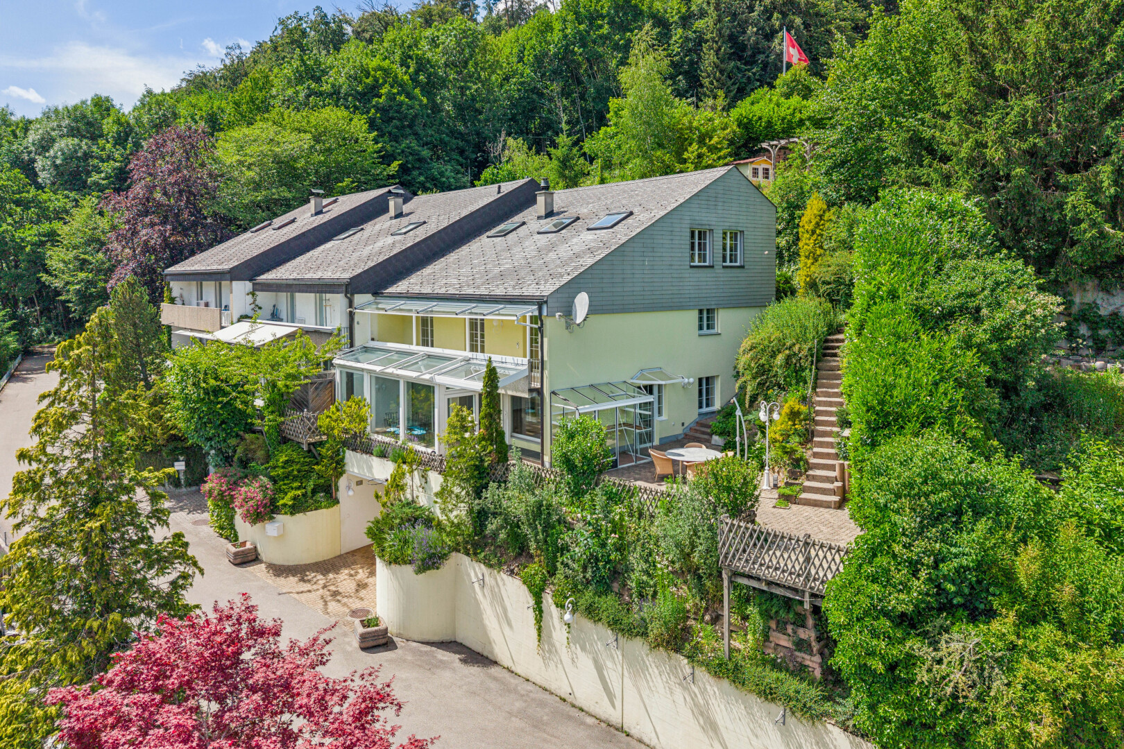 view of home with stairs and stucco siding