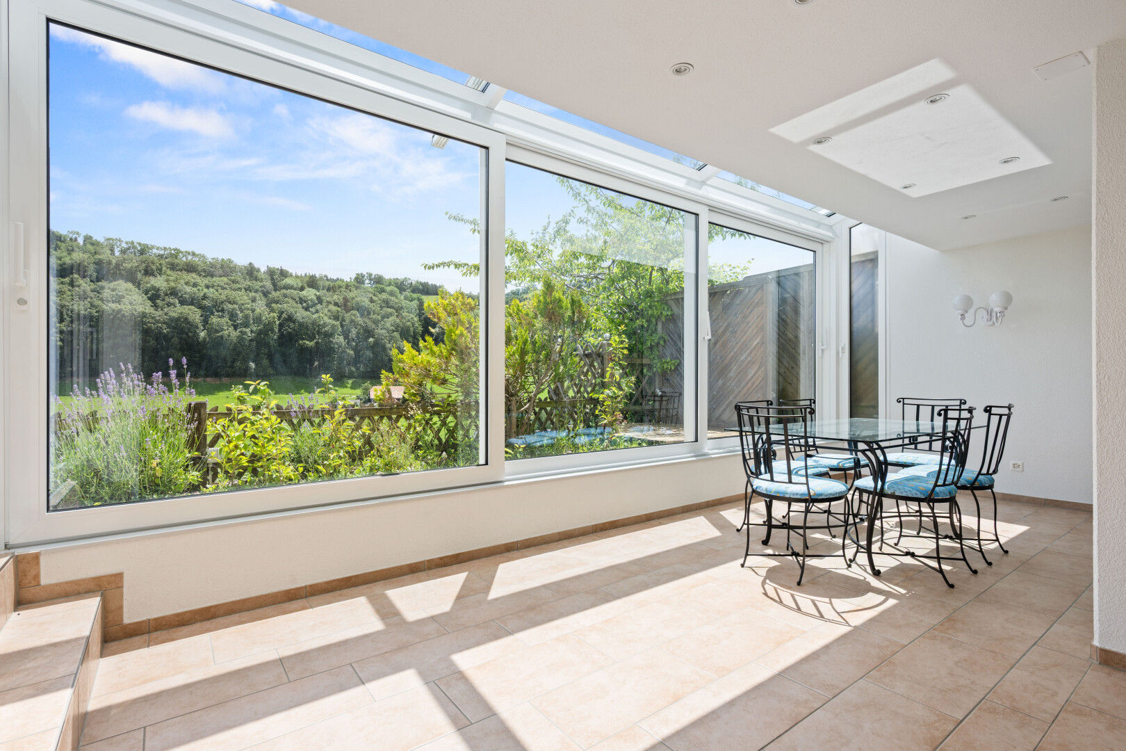 dining area with light tile patterned flooring