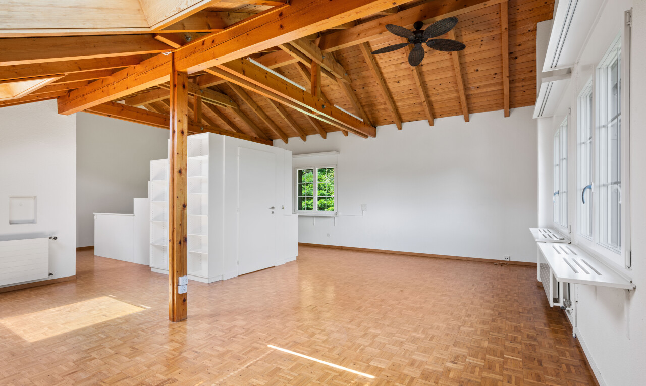 empty room featuring radiator, ceiling fan, parquet flooring, and a wood ceiling with exposed beams